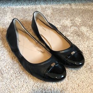 Cole Haan black leather ballet flat.